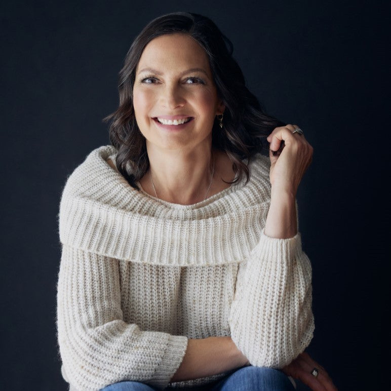 Naomi Simpson headshot in a soft white sweater